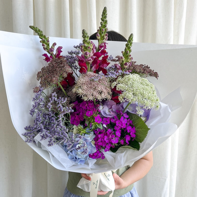 Soft jewel tone bouquet with burgundy, purple and magenta flowers