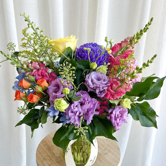 colourful flower arrangement in a glass vase