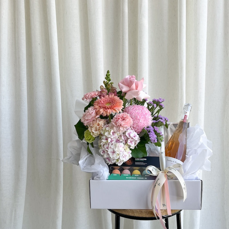 flower hamper with wine and chocolate