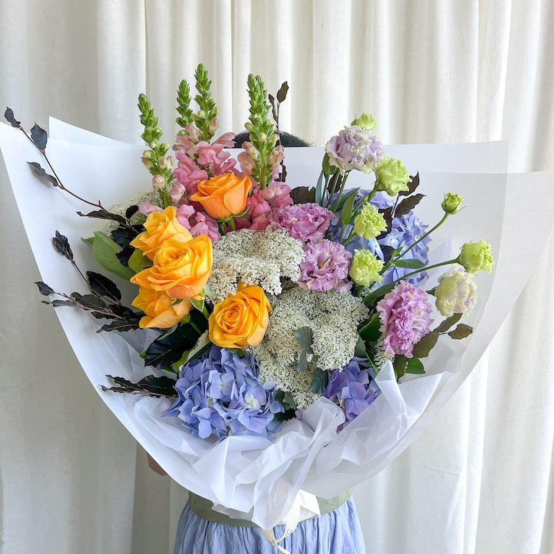 Bright Wishes Blooms get well soon bouquet with blue, mauve, pink and yellow flowers