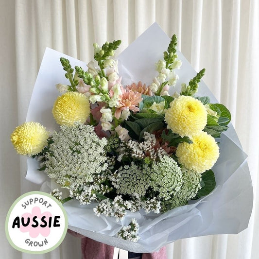 Bouquet of flowers wrapped in white paper