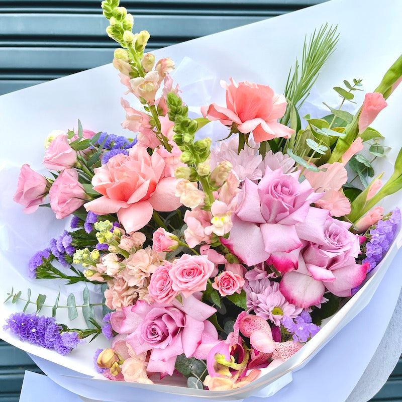 colourful pastel roses and seasonal flower bouquet