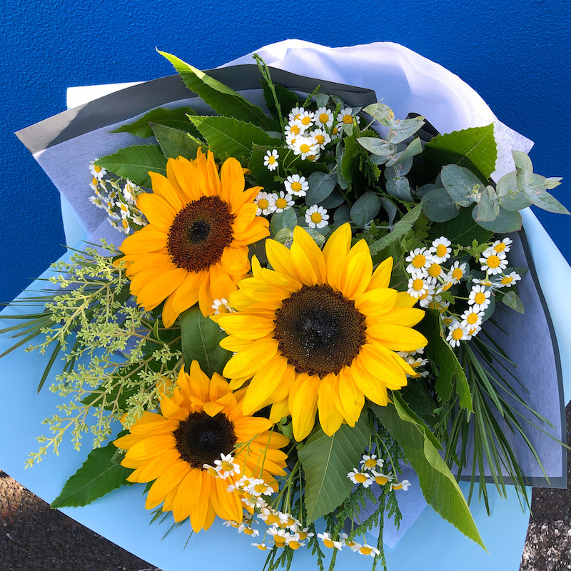 Australia grown sunflowers and seasonal flowers in a bouquet